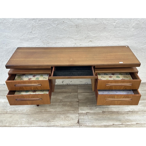 1152 - A mid 20th century G Plan Fresco teak floating top dressing table - approx. 70cm high x 152cm wide x... 
