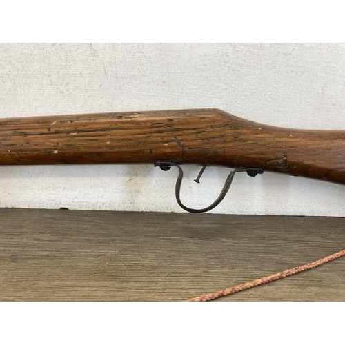 A vintage scratch built pitch pine rifle - approx. 110cm in length