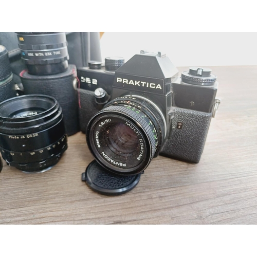 37 - A camera bag containing two Pentacon Praktica M42-mount 35mm SLR cameras, one L fitted with Meyer-Op... 