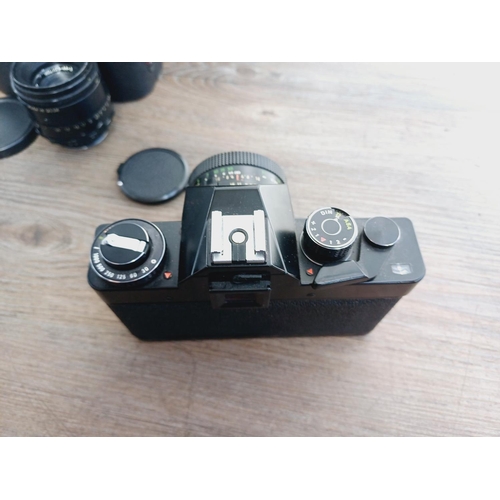 37 - A camera bag containing two Pentacon Praktica M42-mount 35mm SLR cameras, one L fitted with Meyer-Op... 