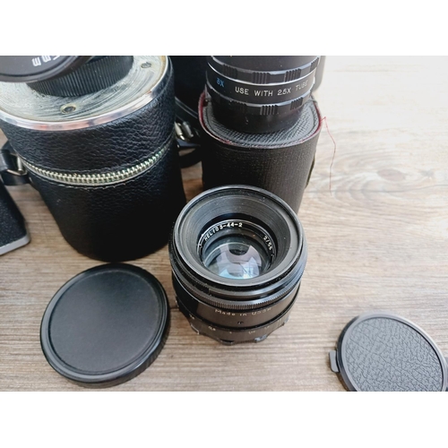 37 - A camera bag containing two Pentacon Praktica M42-mount 35mm SLR cameras, one L fitted with Meyer-Op... 