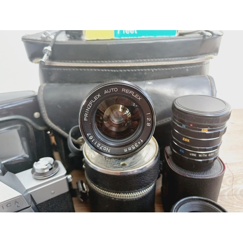 37 - A camera bag containing two Pentacon Praktica M42-mount 35mm SLR cameras, one L fitted with Meyer-Op... 