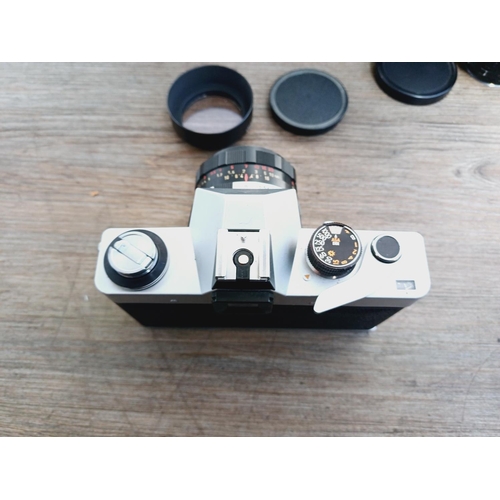 37 - A camera bag containing two Pentacon Praktica M42-mount 35mm SLR cameras, one L fitted with Meyer-Op... 