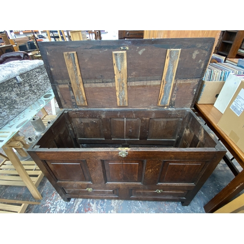 109 - A Georgian oak panelled coffer - approx. 80cm high x 132cm wide x 57cm deep