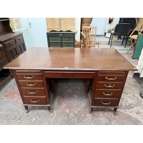 1218 - An Edwardian mahogany pedestal desk on brass castors - approx. 76cm high x 153cm wide x 83cm deep