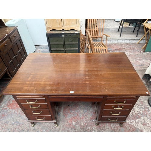 1218 - An Edwardian mahogany pedestal desk on brass castors - approx. 76cm high x 153cm wide x 83cm deep