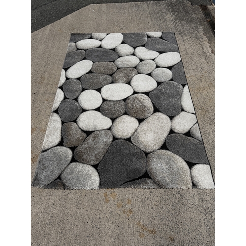 A Woodland cream and grey pebble design rug - approx. 230cm long x ...