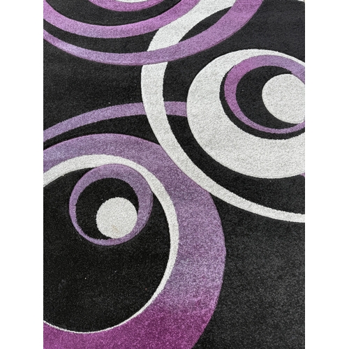 A Home Trends Vive Collection purple, silver and black rug - approx ...