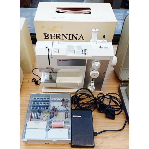 609 - A cased Bernina 1008 electric sewing machine with foot pedal and attachments
