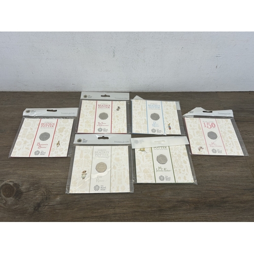 Six packaged brilliant uncirculated Beatrix Potter fifty pence coins ...