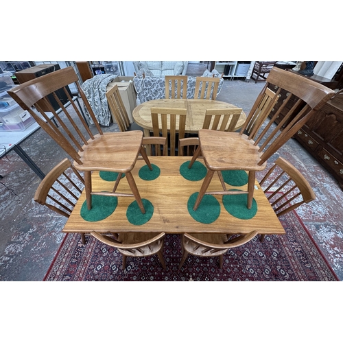 42 - A 1970s Reynolds of Ludlow walnut dining table and eight Ercol style beech spindle back dining chair... 