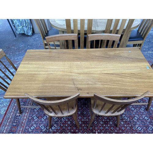 42 - A 1970s Reynolds of Ludlow walnut dining table and eight Ercol style beech spindle back dining chair... 