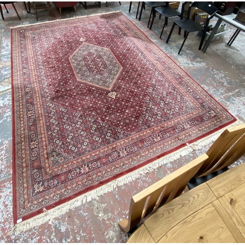 48A - A Hand Made Carpets Ltd Royal Keshan red ground rug - approx. 380cm x 273cm