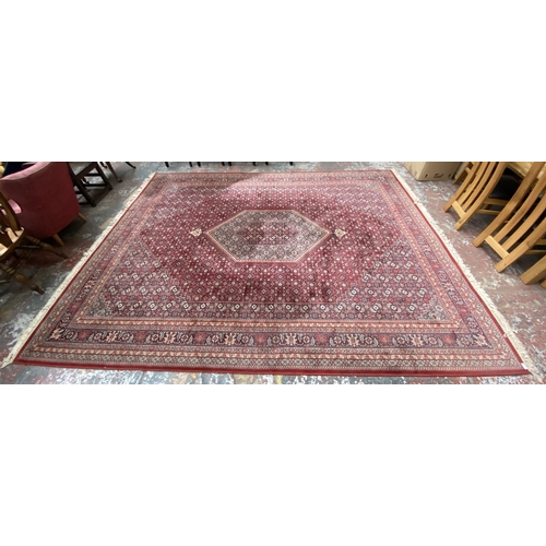 48A - A Hand Made Carpets Ltd Royal Keshan red ground rug - approx. 380cm x 273cm