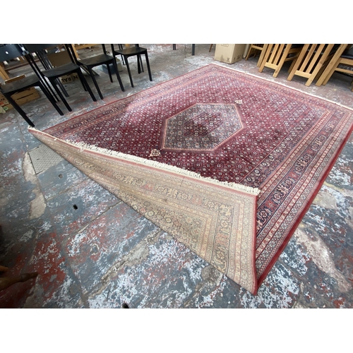 48A - A Hand Made Carpets Ltd Royal Keshan red ground rug - approx. 380cm x 273cm