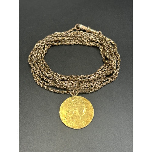 2254 - A 1775 George III 22ct gold guinea on 9ct gold chain - approx. gross weight 27.96g