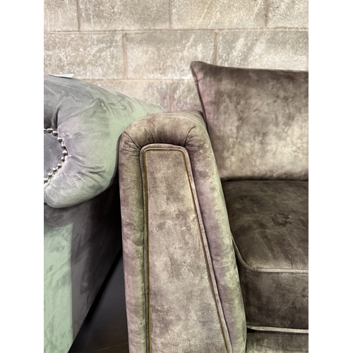 1015A - A brown velvet upholstered armchair on brass tapered supports - approx. 96cm high x 99cm wide x 89cm... 