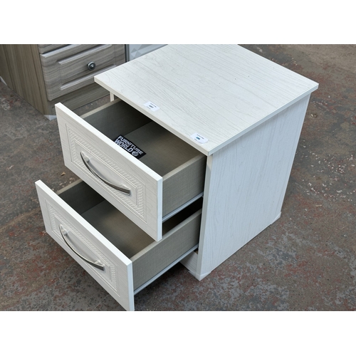 1007 - A modern white laminate bedside chest of drawers - approx. 50cm high x 40cm wide x 40cm deep