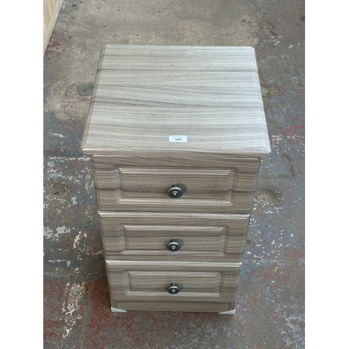 1008 - A modern grey wood effect bedside chest of drawers - approx. 69.5cm high x 40cm wide x 40cm deep