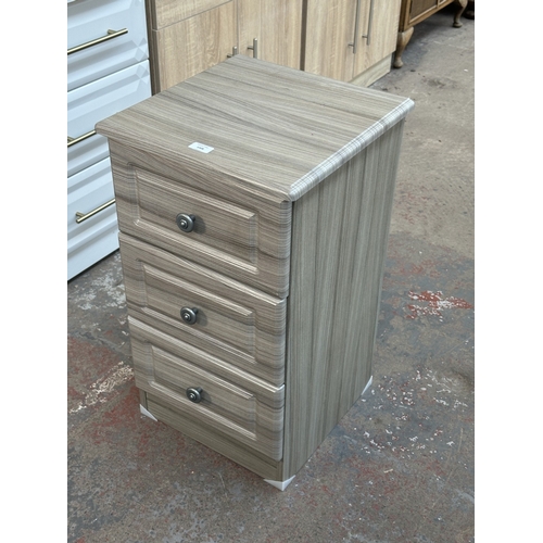 1008 - A modern grey wood effect bedside chest of drawers - approx. 69.5cm high x 40cm wide x 40cm deep