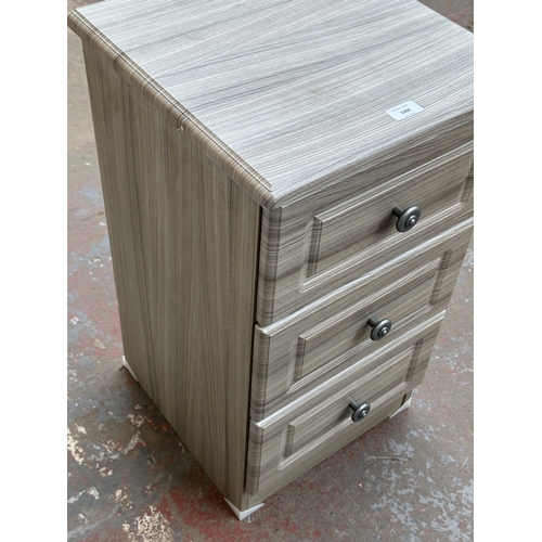 1008 - A modern grey wood effect bedside chest of drawers - approx. 69.5cm high x 40cm wide x 40cm deep