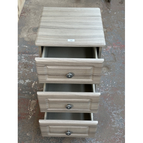 1008 - A modern grey wood effect bedside chest of drawers - approx. 69.5cm high x 40cm wide x 40cm deep