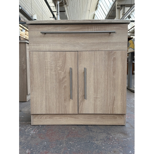 1010 - A modern oak effect sideboard - approx. 79.5cm high x 76.5cm wide x 41.5cm deep