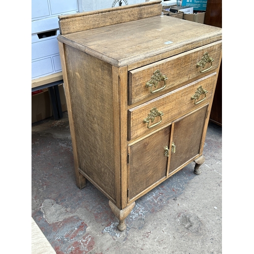 1012 - A 1930s oak tallboy/linen cabinet - approx. 100cm high x 67cm wide x 43cm deep