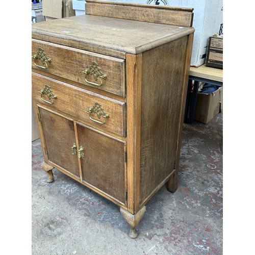 1012 - A 1930s oak tallboy/linen cabinet - approx. 100cm high x 67cm wide x 43cm deep