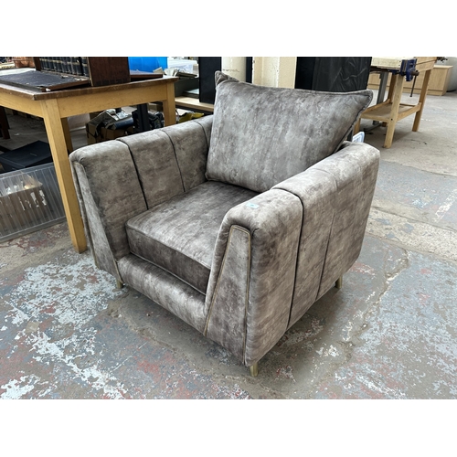 1015A - A brown velvet upholstered armchair on brass tapered supports - approx. 96cm high x 99cm wide x 89cm... 