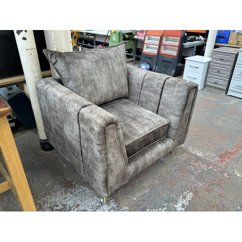 1015A - A brown velvet upholstered armchair on brass tapered supports - approx. 96cm high x 99cm wide x 89cm... 