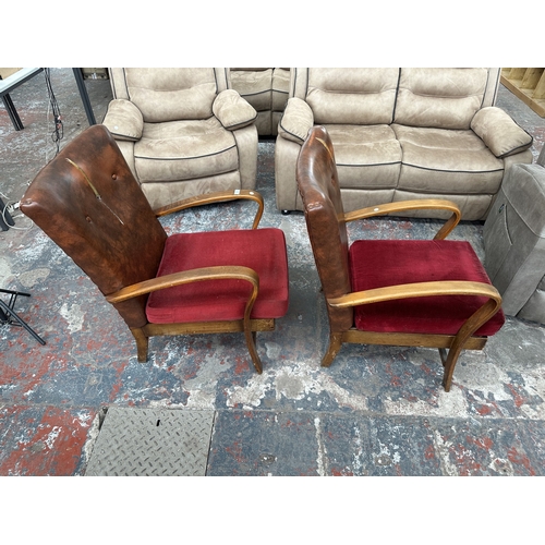 1021 - A pair of mid 20th century beech bentwood armchairs with tan vinyl upholstered backs and red fabric ... 
