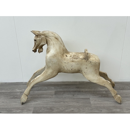 1023 - A Victorian style painted carved wooden rocking horse body - approx. 75cm high x 32cm wide x 106cm d... 