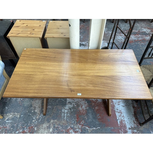1024 - A 1970s Reynolds of Ludlow walnut dining table - approx. 73cm high x 76cm wide x 151cm long
