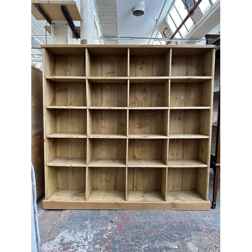1027 - A Victorian style pine twenty section shelving unit - approx. 142cm high x 147cm wide x 23cm deep