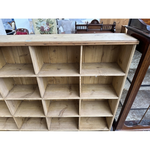 1027 - A Victorian style pine twenty section shelving unit - approx. 142cm high x 147cm wide x 23cm deep