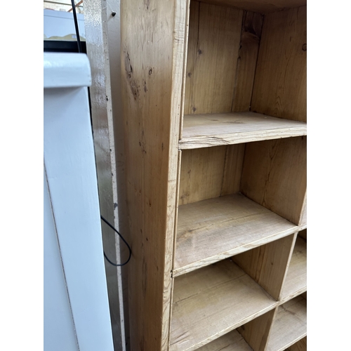 1027 - A Victorian style pine twenty section shelving unit - approx. 142cm high x 147cm wide x 23cm deep