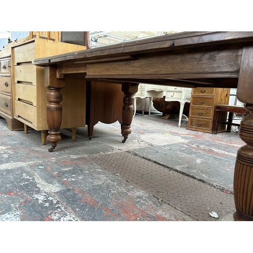 1038 - A Victorian walnut wind out dining table - approx. 74cm high x 104cm wide x 178cm long