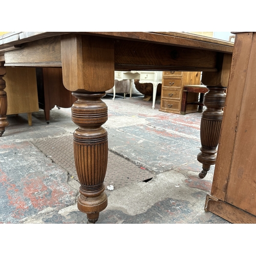 1038 - A Victorian walnut wind out dining table - approx. 74cm high x 104cm wide x 178cm long
