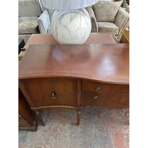 1043 - An A.H. McIntosh & Co. Ltd mahogany serpentine sideboard - approx. 91cm high x 164cm wide x 51cm dee... 