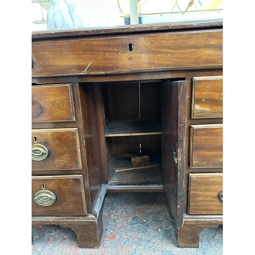 1045 - A 19th century mahogany kneehole pedestal desk - approx. 73cm high x 95cm wide x 53cm deep