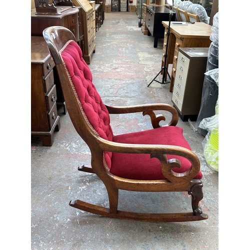 1046 - A 19th century mahogany and red button back fabric upholstered rocking chair - approx. 103cm high x ... 