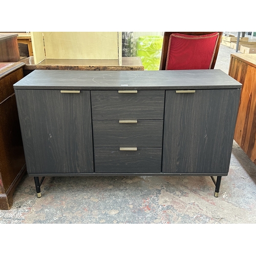 1052 - A modern black ash effect sideboard on black metal and brushed brass effect supports - approx. 74cm ... 