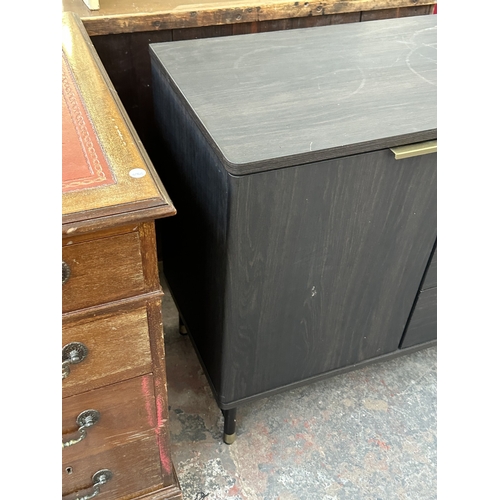 1052 - A modern black ash effect sideboard on black metal and brushed brass effect supports - approx. 74cm ... 