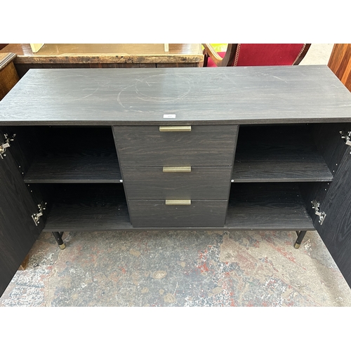 1052 - A modern black ash effect sideboard on black metal and brushed brass effect supports - approx. 74cm ... 
