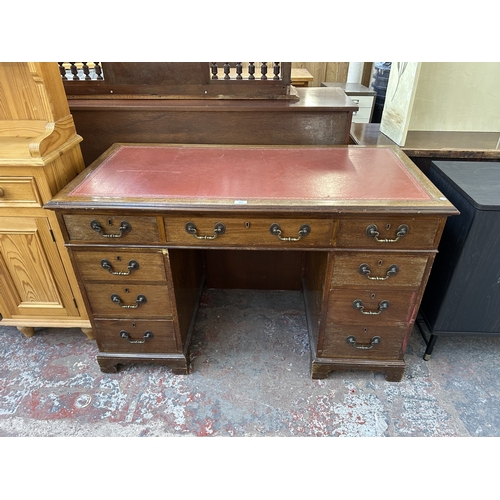 1053 - An early 20th century mahogany and red leather pedestal desk - approx. 77cm high x 123cm wide x 61cm... 