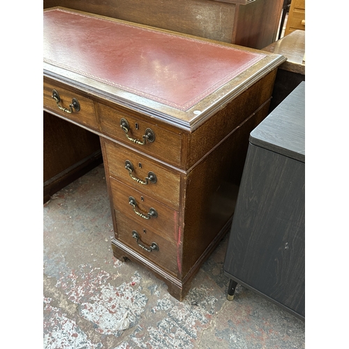 1053 - An early 20th century mahogany and red leather pedestal desk - approx. 77cm high x 123cm wide x 61cm... 