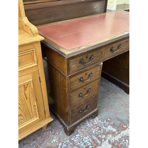 1053 - An early 20th century mahogany and red leather pedestal desk - approx. 77cm high x 123cm wide x 61cm... 