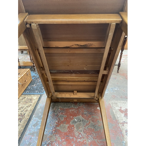 1131 - A mid 20th century Gordon Russell walnut dining table and eight chairs with grey vinyl upholstery - ... 