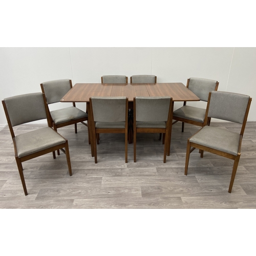 1131 - A mid 20th century Gordon Russell walnut dining table and eight chairs with grey vinyl upholstery - ... 